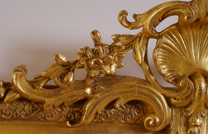 Detail of Louis style gilded mirror frame.