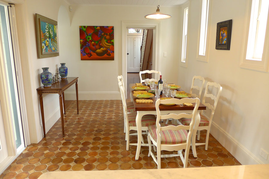 French provincial dining table with ladderback chairs