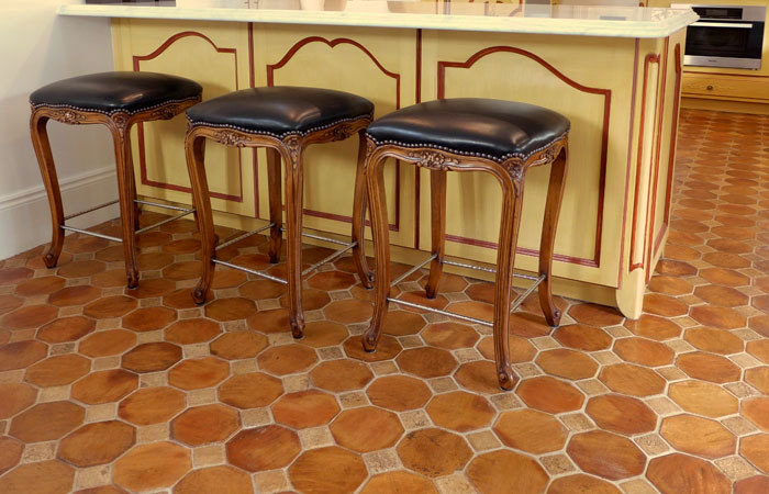 Louis kitchen stools and hand-rubbed terracotta tiles