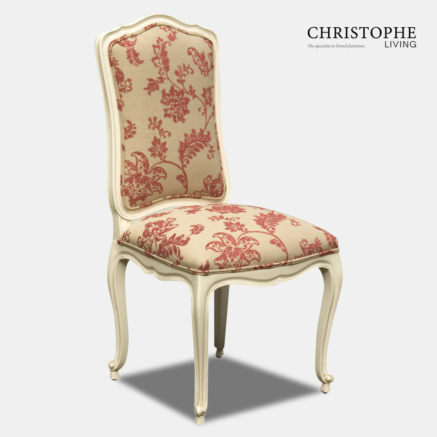 French Chateaux style dining chair in cream finish with red and cream floral damask fabric and double piping on upholstery.