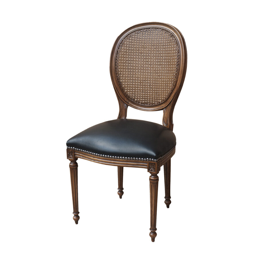 Classic looking French Louis style dining chair with cane back in timber and black leather upholstery with studding