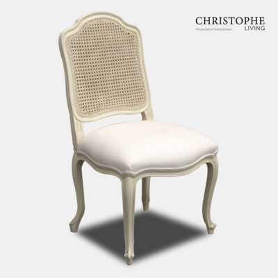 Wide back French provincial Louis XV style dining chair in cream painted finish with painted can back and linen seat.