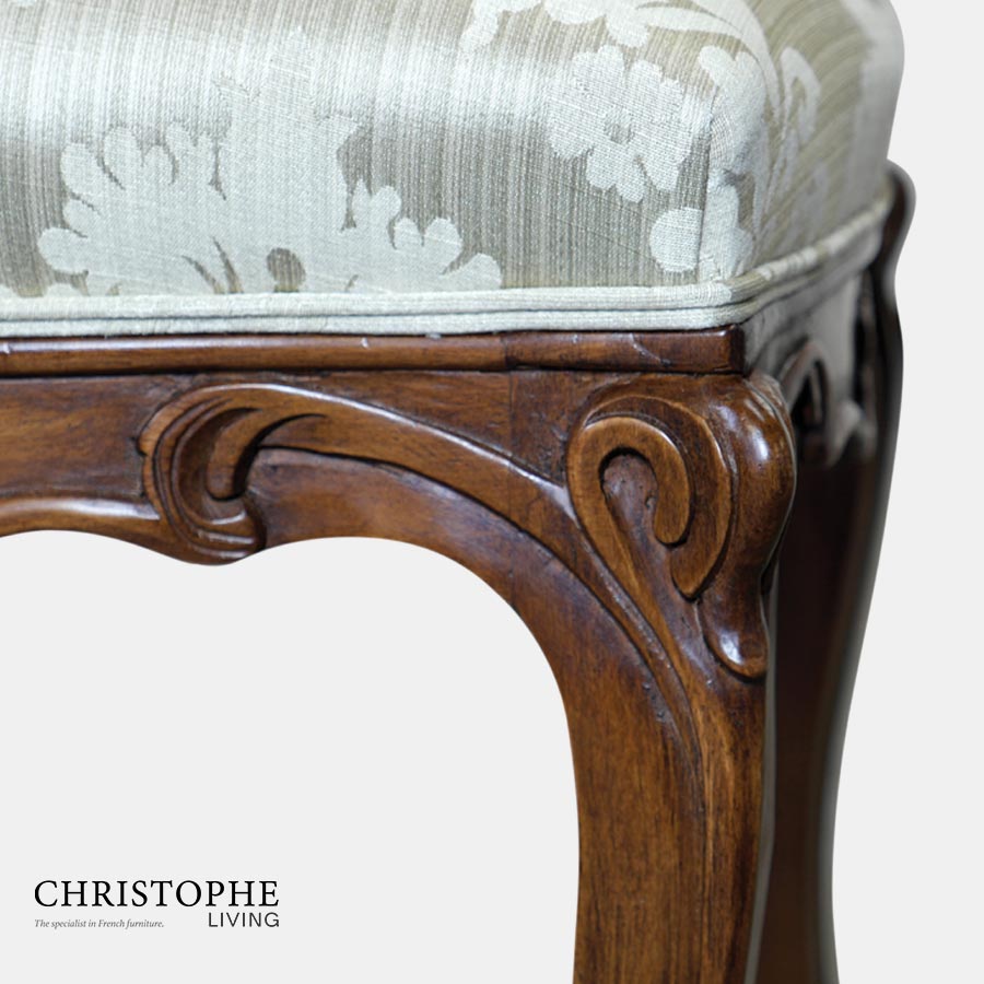 Luxurious French style dining chair fully upholstered in French blue damask with dark timber legs and ornate carvings