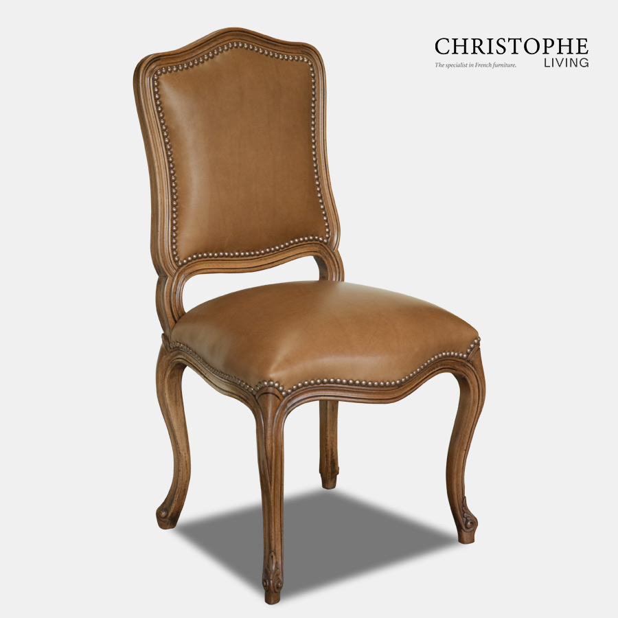 Timber chair in French Louis style with curved carvings and brown leather sith studding in classic look.