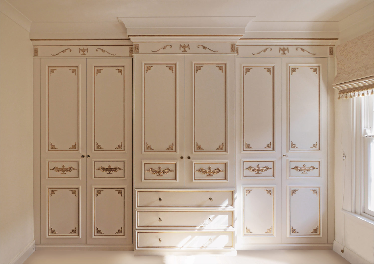 1-French-style-wardrobe-in-white-with-gold-trim-and-ornamentation-