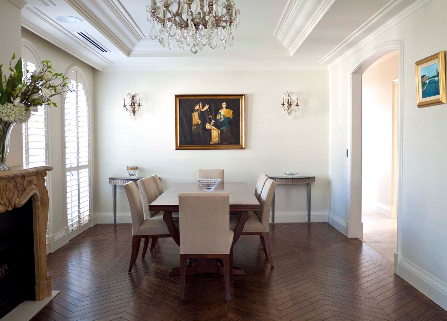 1 Modern french dining with chandelier, hall tables and wall lights and art