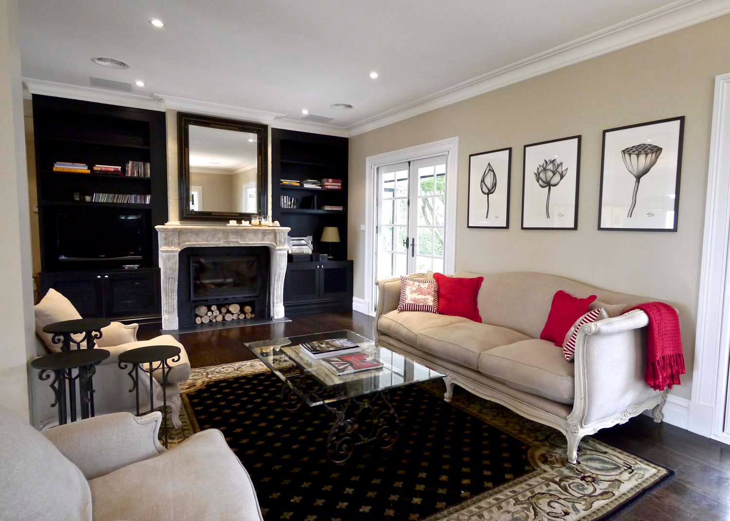 10 French lounge with painted Louis XV daybed, glass coffee table, black library, fireplace, mirror with black framing