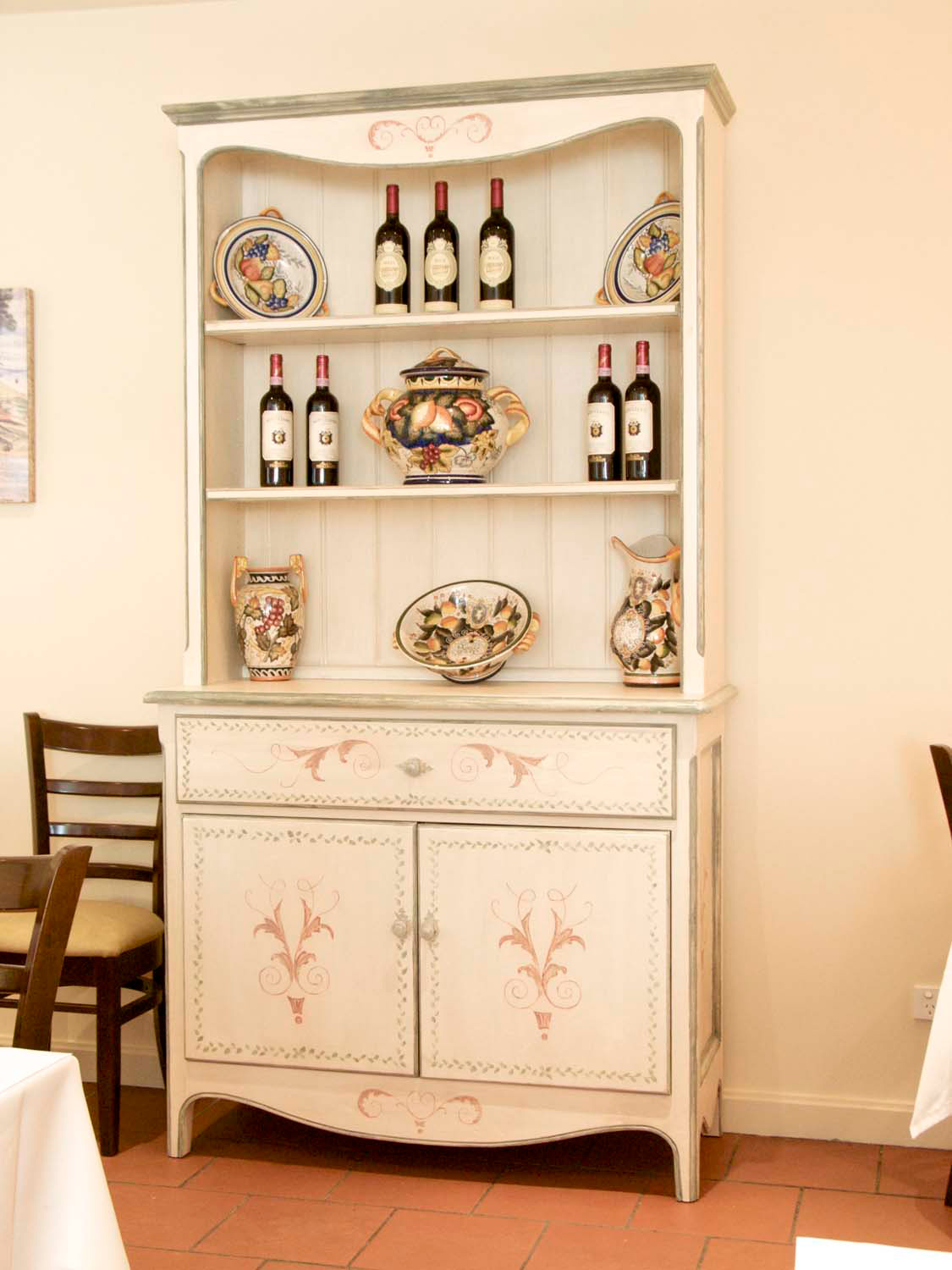 3 French buffet sideboard with painted motifs in dining room with dining chair