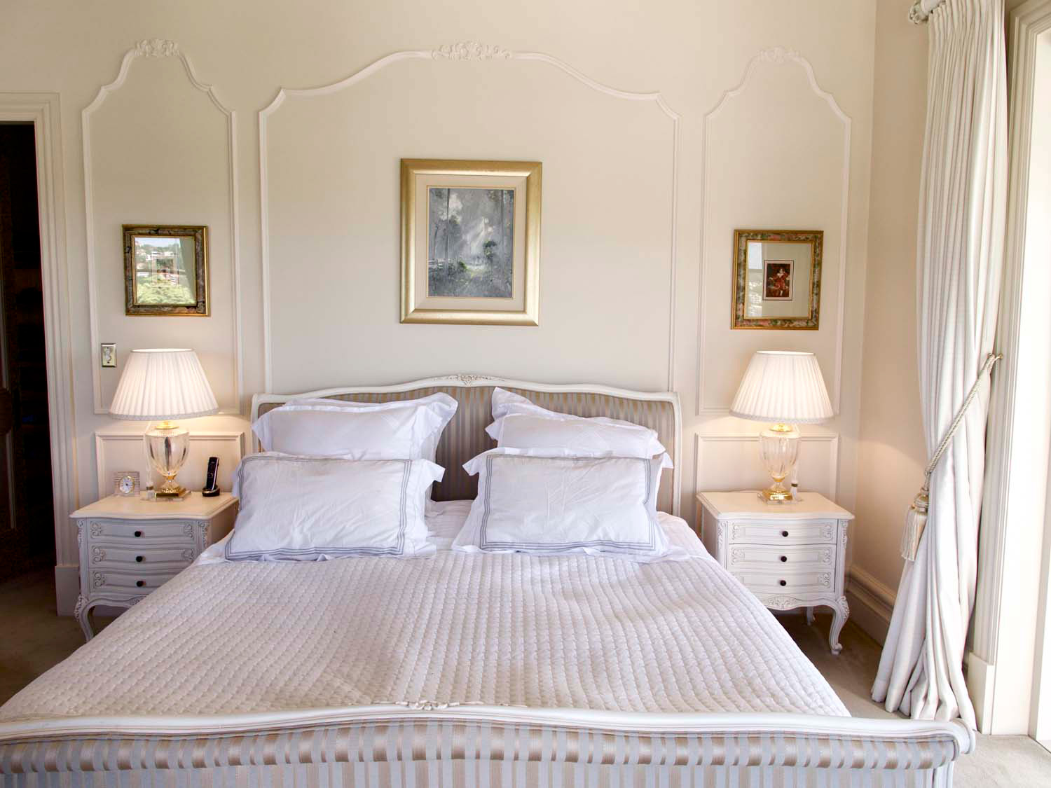 5 Bedroom with wall panelling and french bed and bedside tables and lights