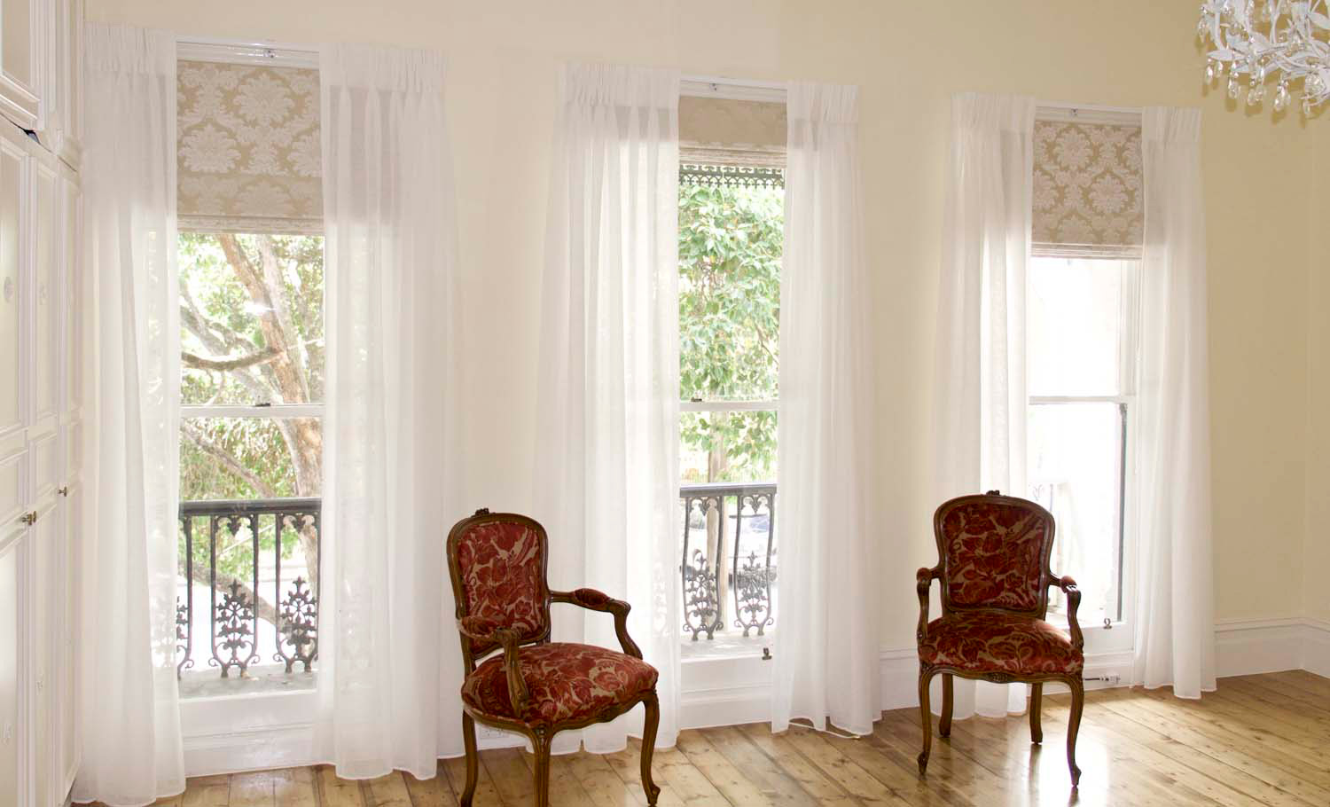5 French style interior, two french chairs, rich demask fabric and sheer curtains