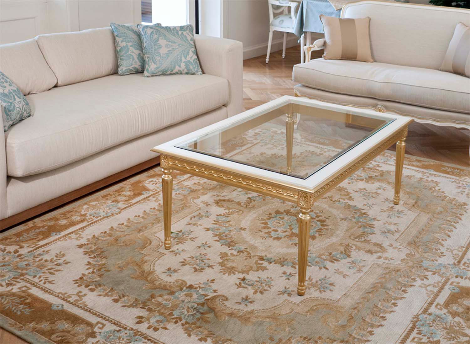 6 Louis XV1 coffee table with glass top and gold base with classical rug and sofas