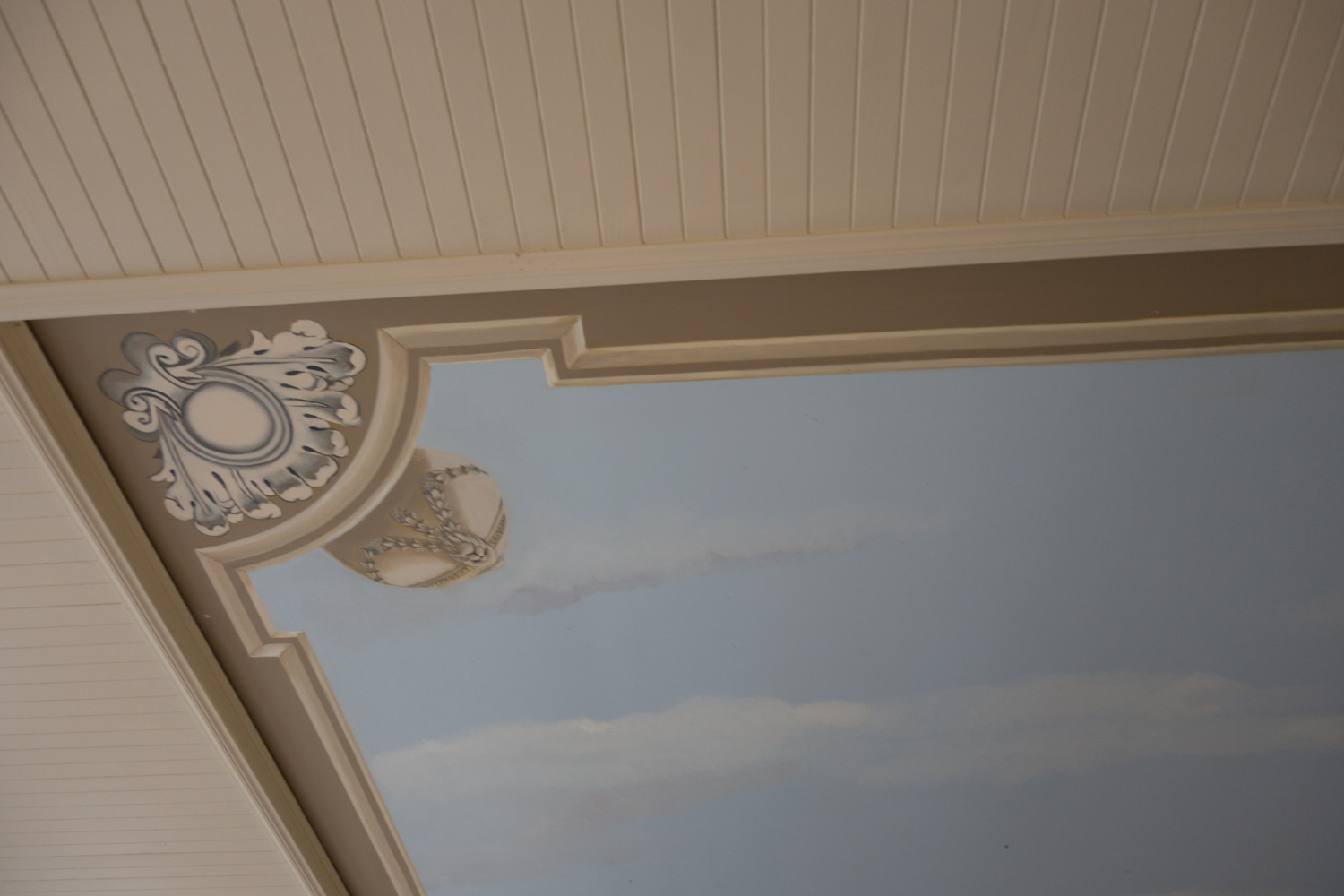 7 Detail of painted ceiling above hotel pool with classical motif and sky