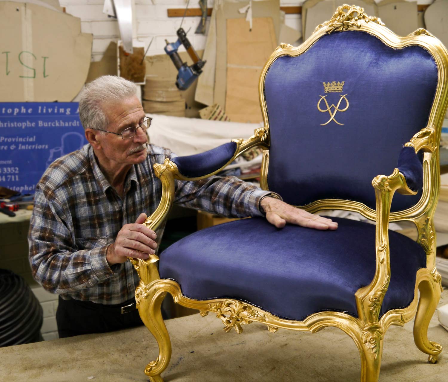 9 Upholsterer checking seat base of louis armchair after upholstery and gilding