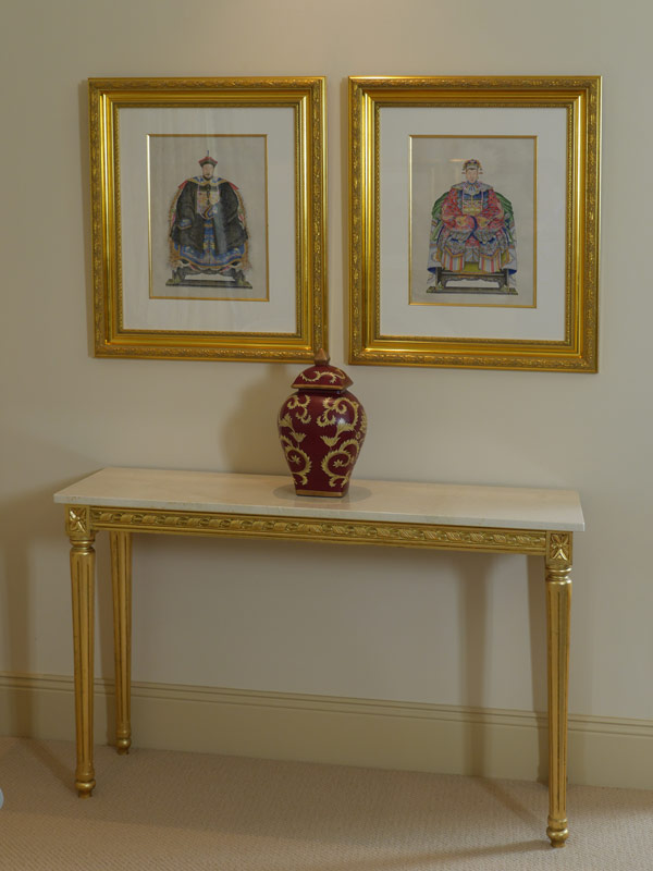 Hall table with framed prints