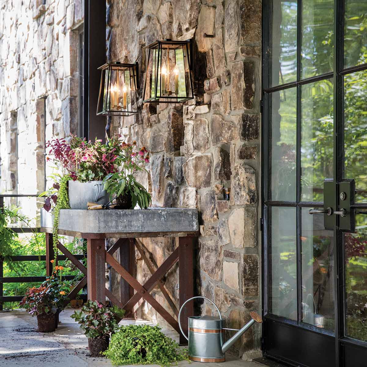 Corbenfield Transitional Outdoor Wall Lantern in Buckeye Bronze and Heritage Brass — in situ view