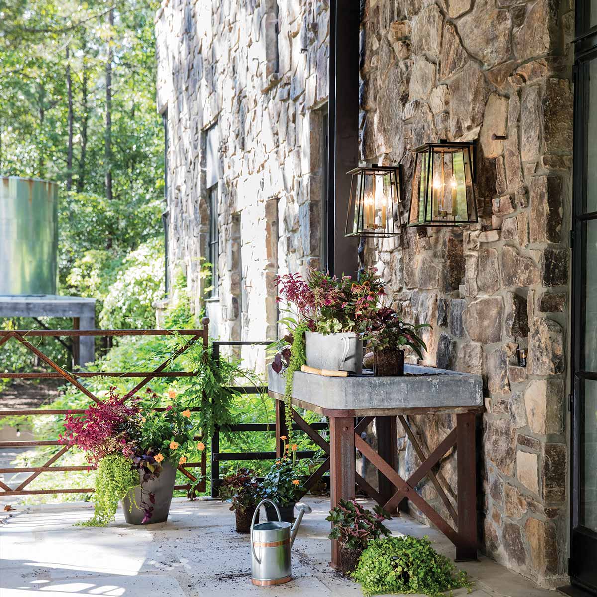 Corbenfield Transitional Outdoor Wall Lantern in Buckeye Bronze and Heritage Brass — in situ view