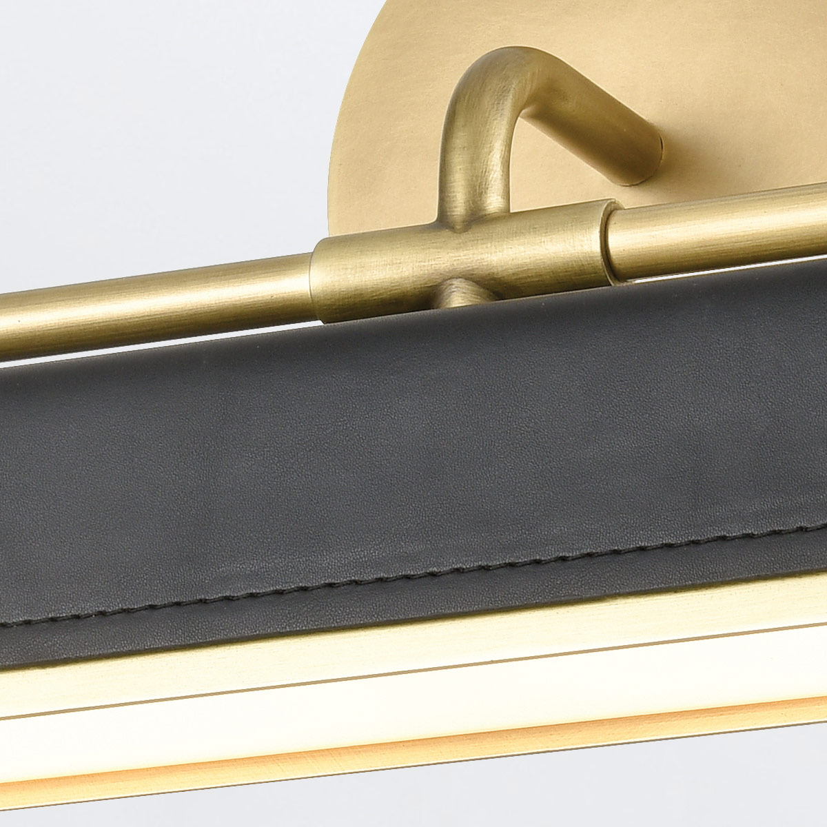 Kirrawee Gate Retro Modern Wall Light in Vintage Brass and Tuxedo Leather — detail view